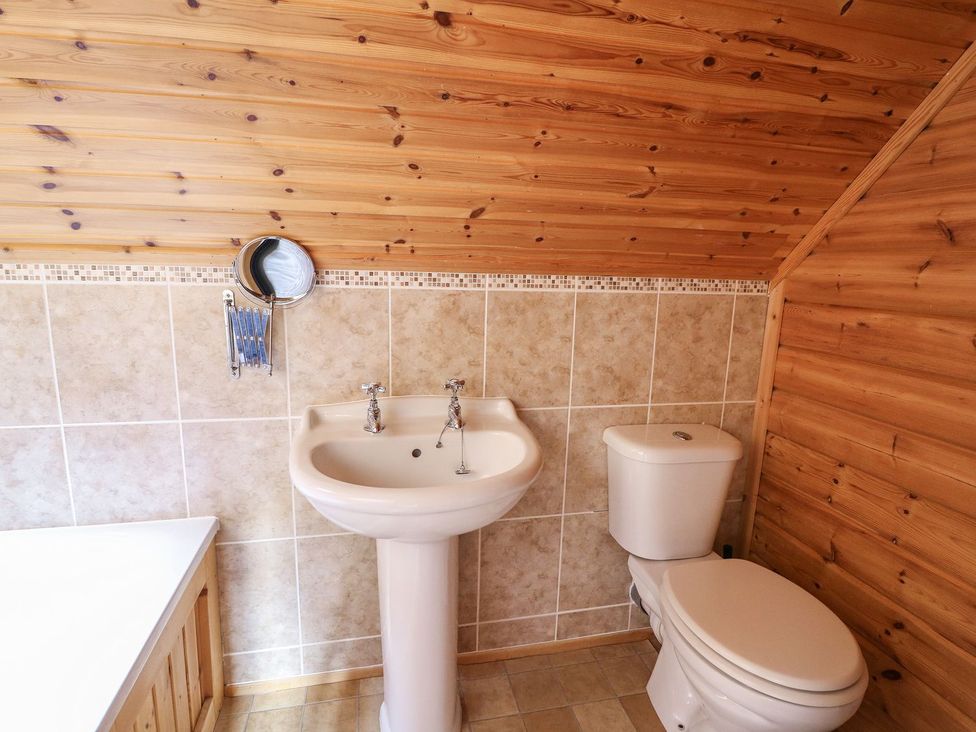 A bathroom with sink and toilet at Pen Y Clawdd near Beggar's Bush