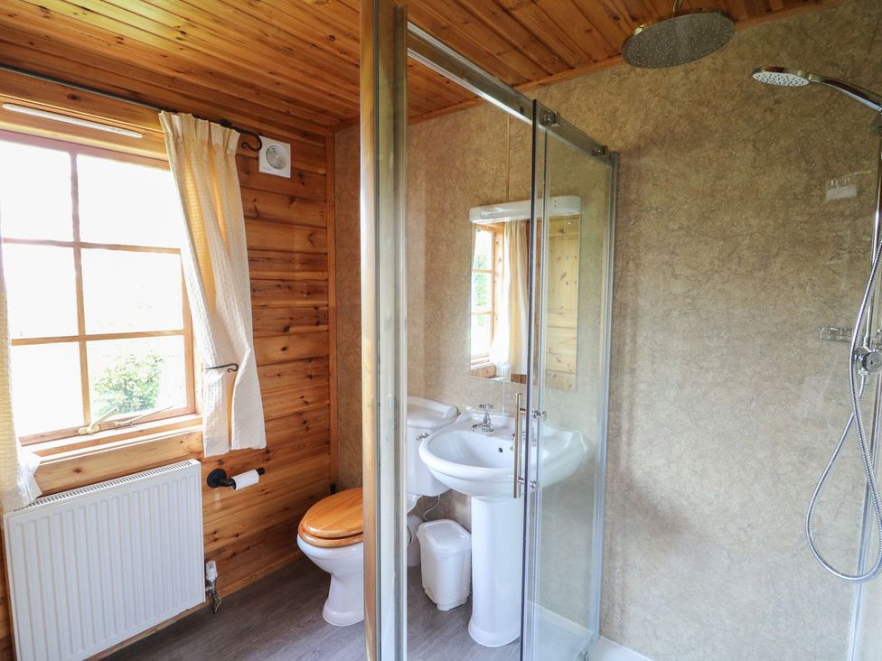 A bathroom with a shower and sink at Pen Y Clawdd Beggar's Bush near Presteigne