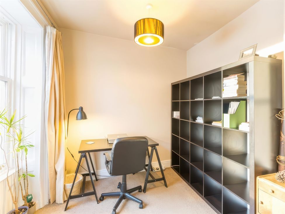 An office with a desk and chair at River Cottage in Inverness