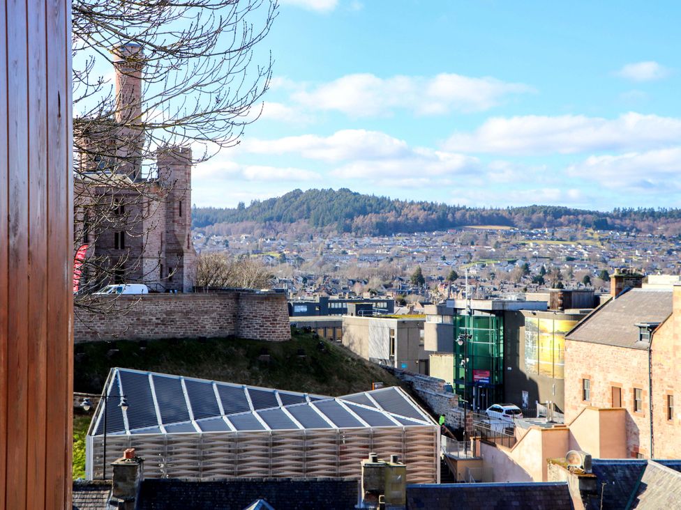 A view of buildings and hills at View Apartment in Inverness