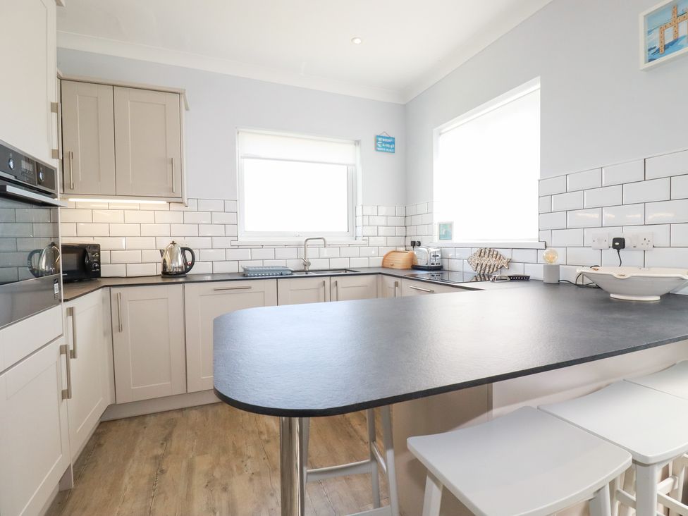 A kitchen with countertops and appliances at 22 Pentire Avenue Newquay