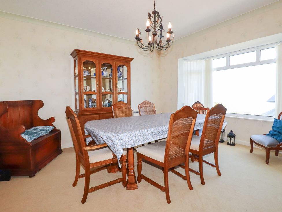 A dining room with a table and chairs at 22 Pentire Avenue, Newquay