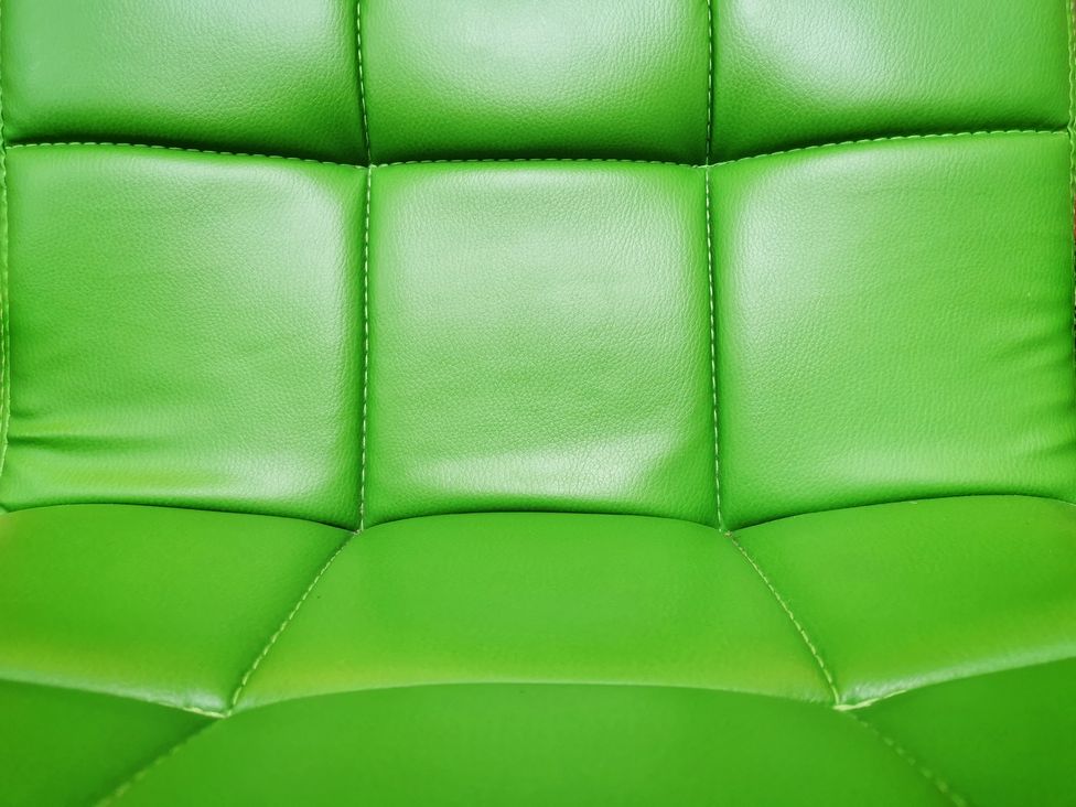 A green leather chair upholstery at Church Retreat St. Leonards-on-Sea