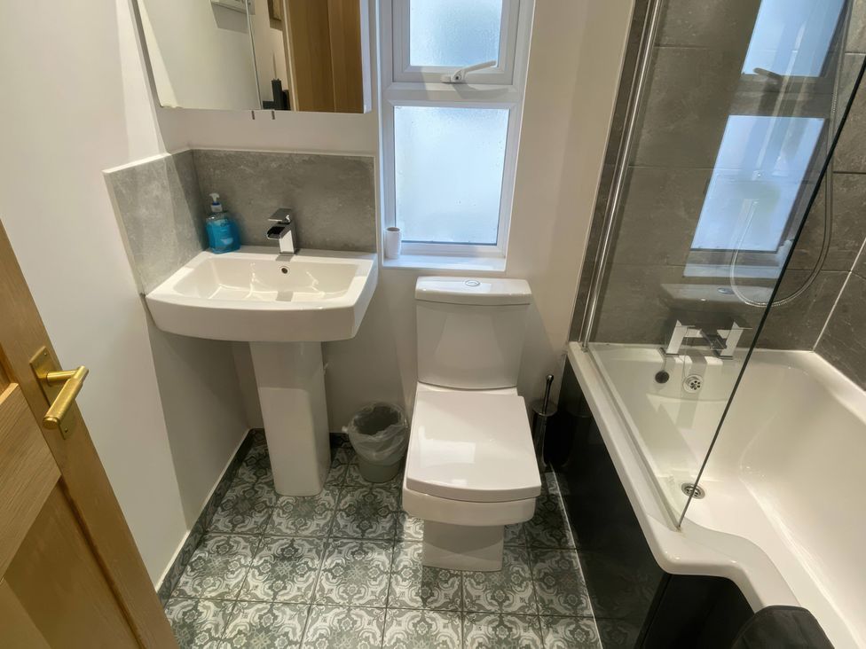A bathroom with sink, toilet, and bathtub at Church Retreat in St. Leonards-on-Sea
