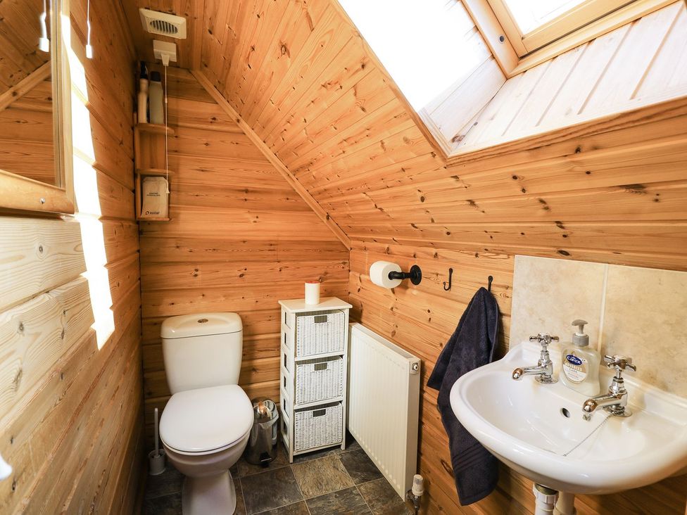 A bathroom with a sink and toilet at Dan Y Coed Beggar's Bush near Presteigne