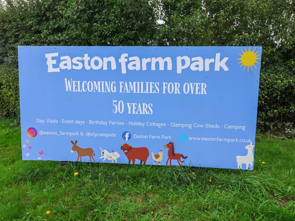 A sign for Easton Farm Park welcoming families for over 50 years Woodbridge