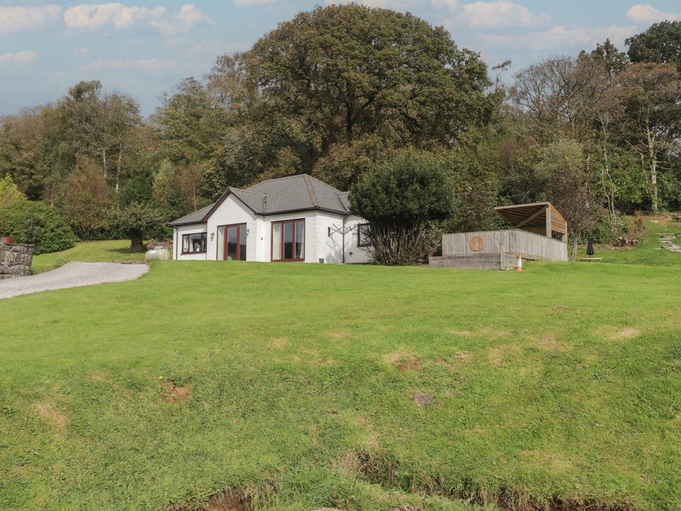 A house with yard and deck at The Lodge in Bridgend