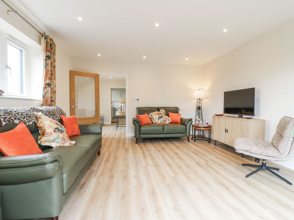 A living room with sofas and a television at Fields View Edingale near Alrewas
