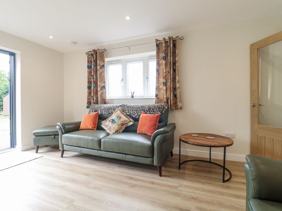 A living room with a sofa and a coffee table at Fields View in Edingale near Alrewas