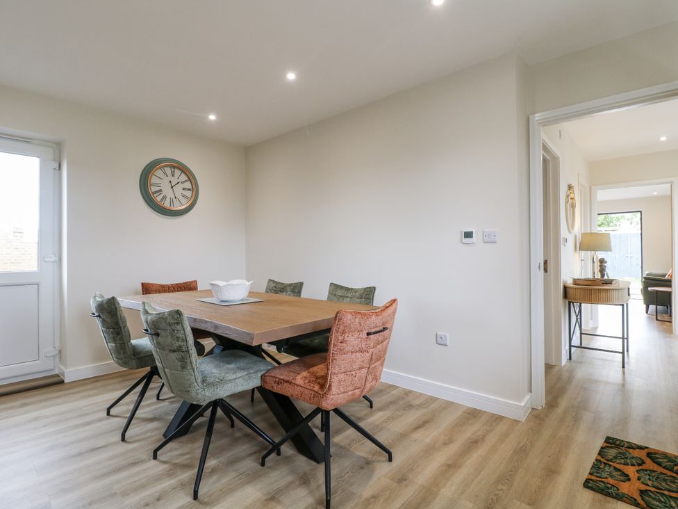 A dining room with a table and chairs at Fields View Edingale near Alrewas
