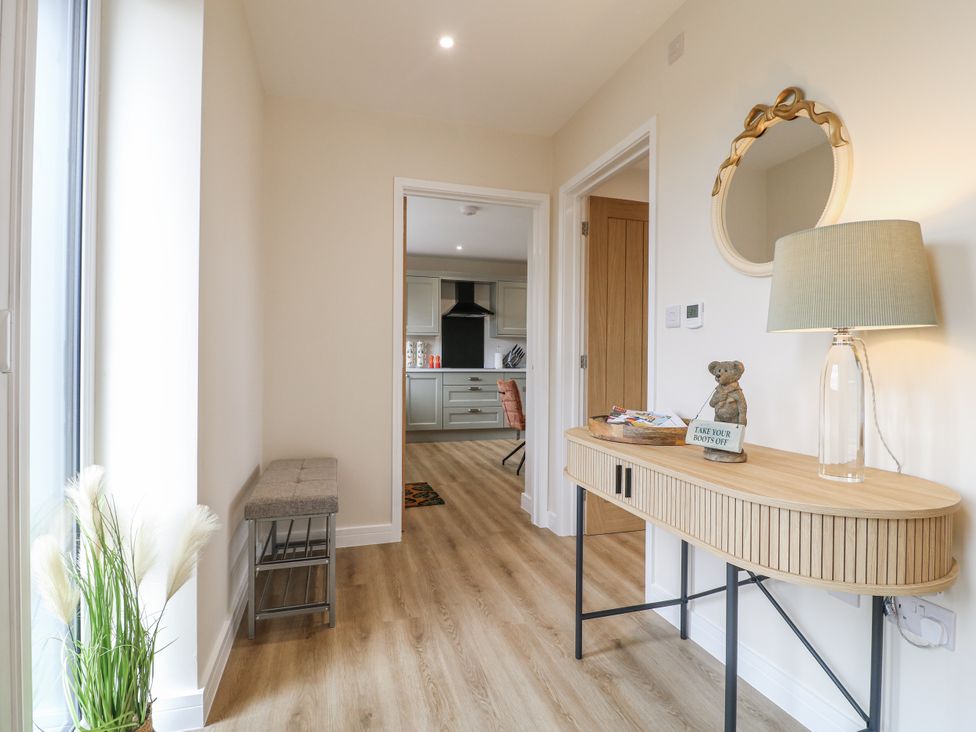 A hallway with a console table and lamp at Fields View Edingale near Alrewas