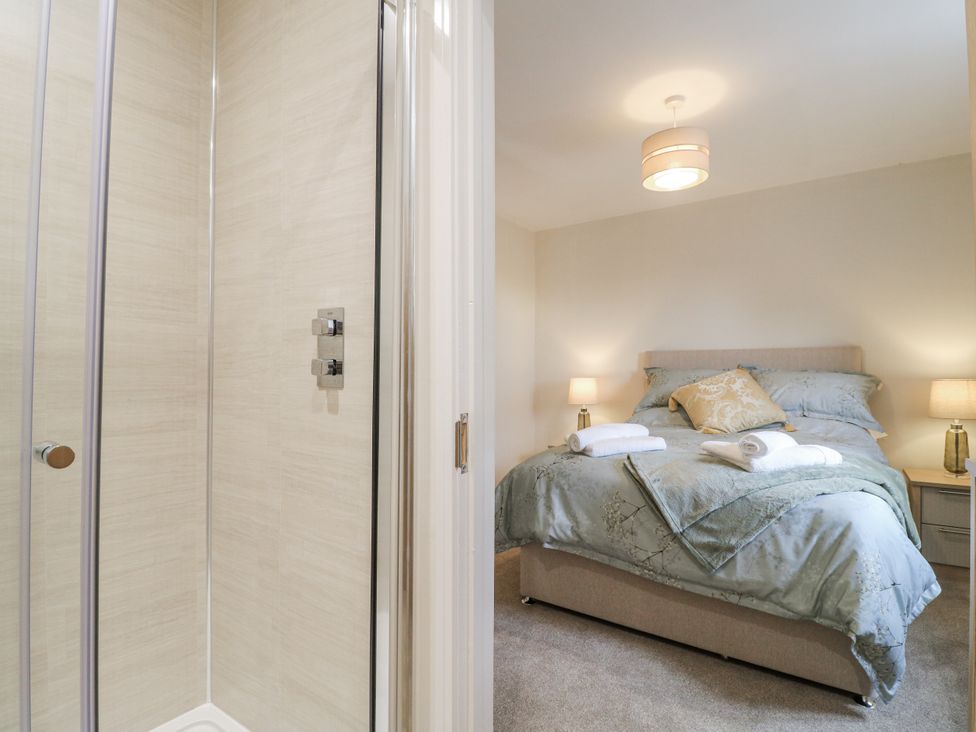 A bedroom with a shower and a bed at Fields View Edingale near Alrewas