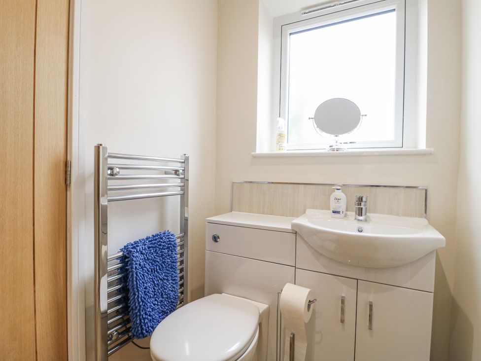 A bathroom with a toilet and wash basin at Fields View in Edingale near Alrewas