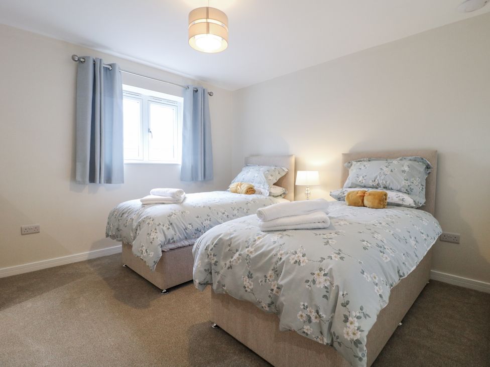 A bedroom with two single beds at Fields View Edingale near Alrewas
