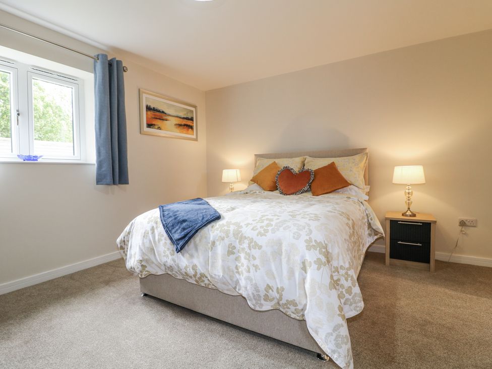 A bedroom with a bed and bedside tables at Fields View in Edingale near Alrewas