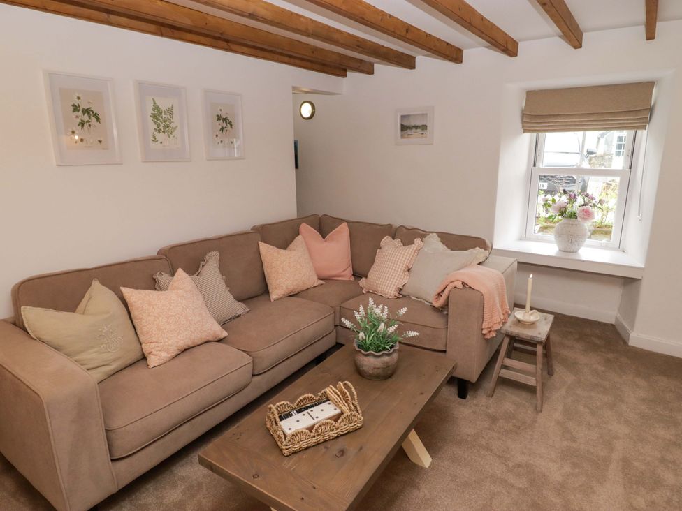 A living room with a sofa and coffee table at Penwyn in Solva