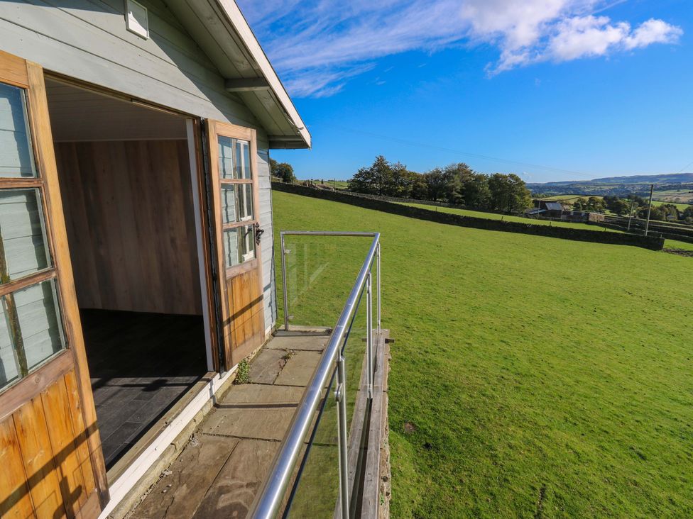 A balcony view of open landscape at 1 Flush House Lane Holmbridge