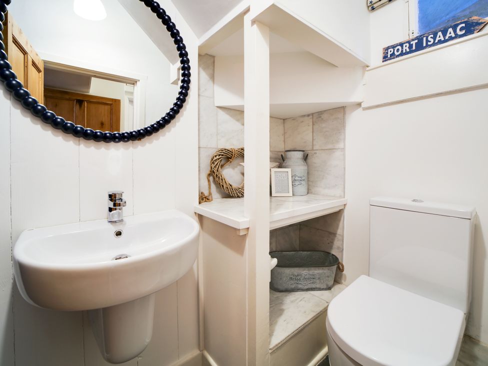 A bathroom with sink and toilet at Church Hill House in Port Isaac