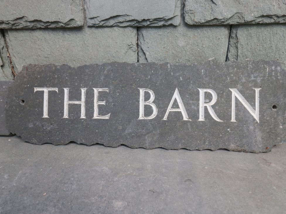 A slate sign with the text 'THE BARN' at The Barn at Grasmere Grasmere