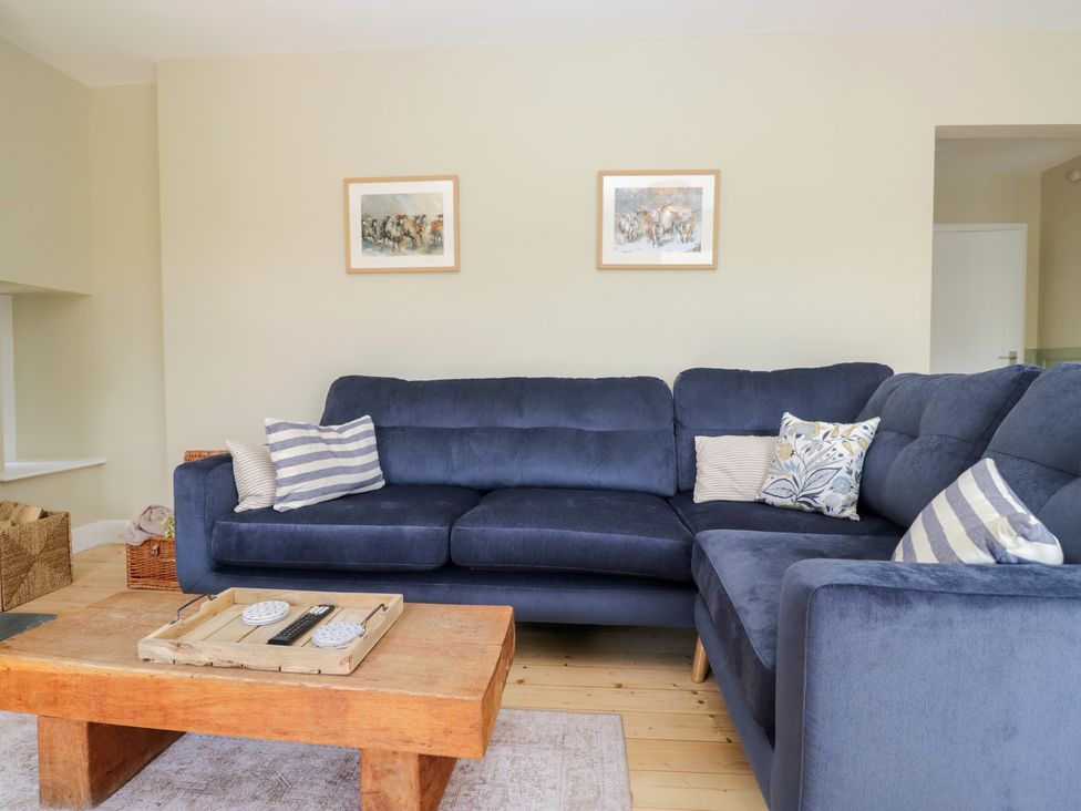 A living room with a sofa and coffee table at The Barn at Grasmere