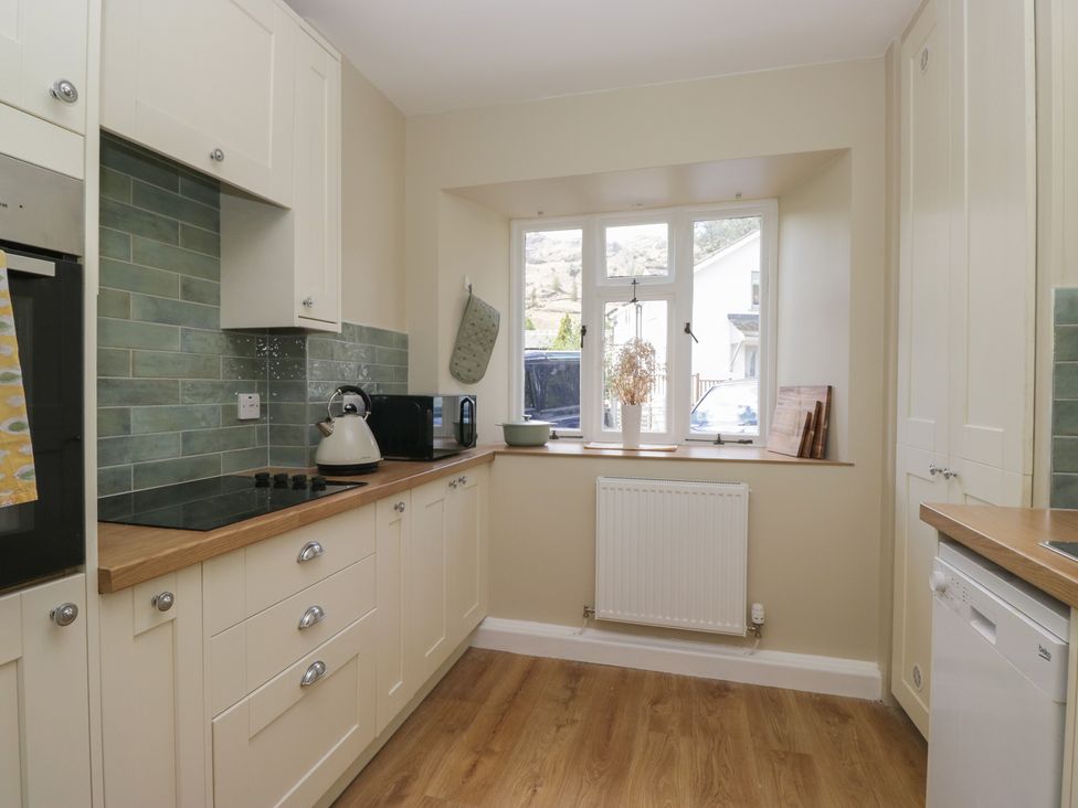 A kitchen with appliances and countertops at The Barn at Grasmere