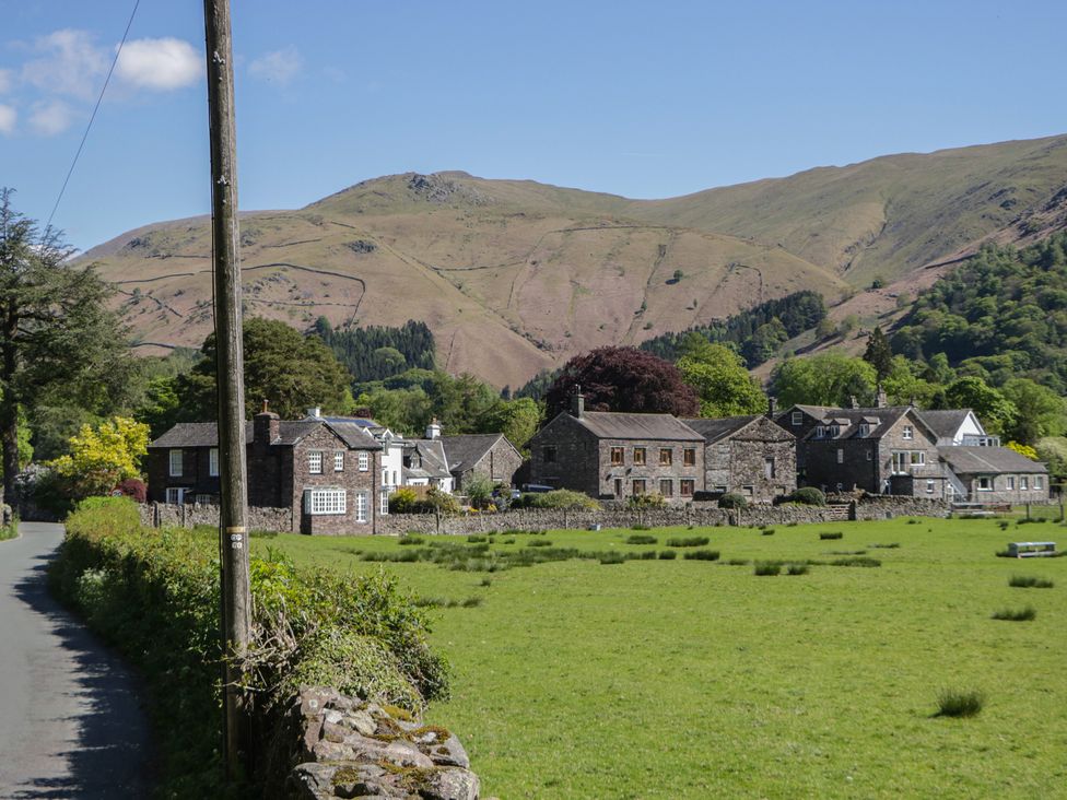 A rural scene with houses and mountains at The Barn at Grasmere in Grasmere