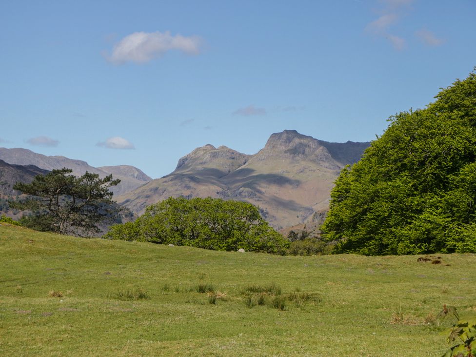 A landscape featuring mountains and trees at The Barn at Grasmere in Grasmere