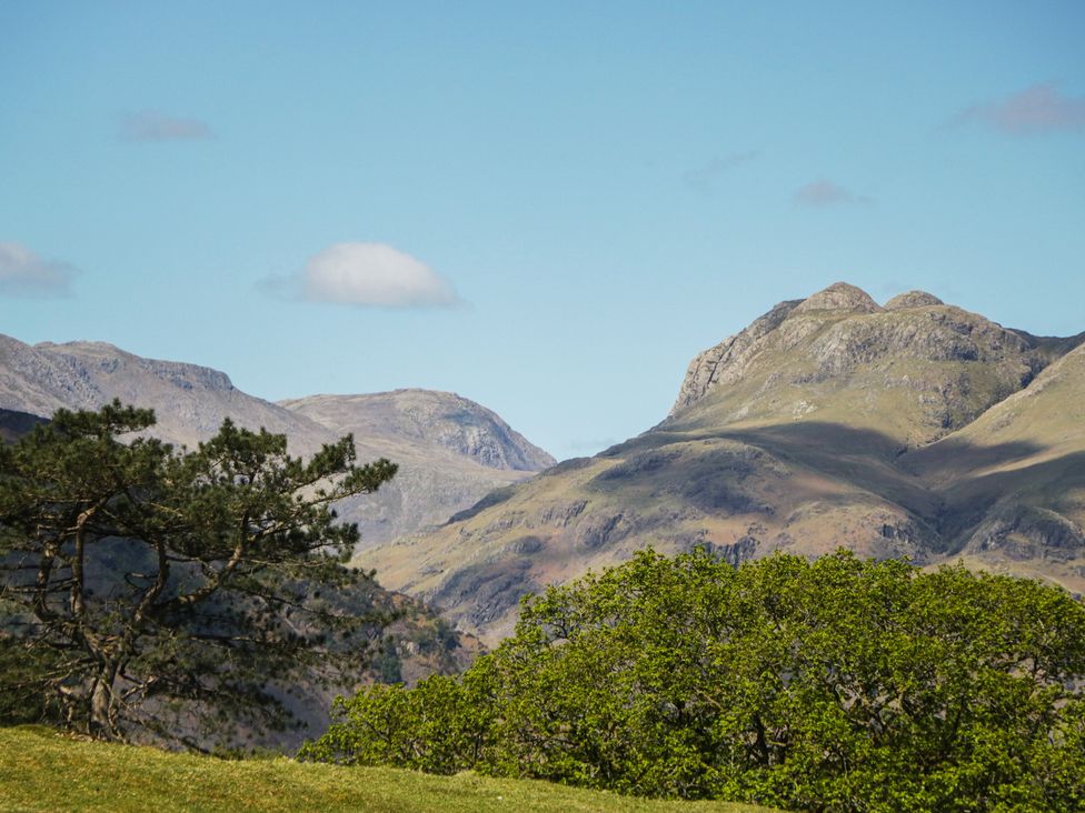 Mountains and trees under a clear sky at The Barn at Grasmere in Grasmere
