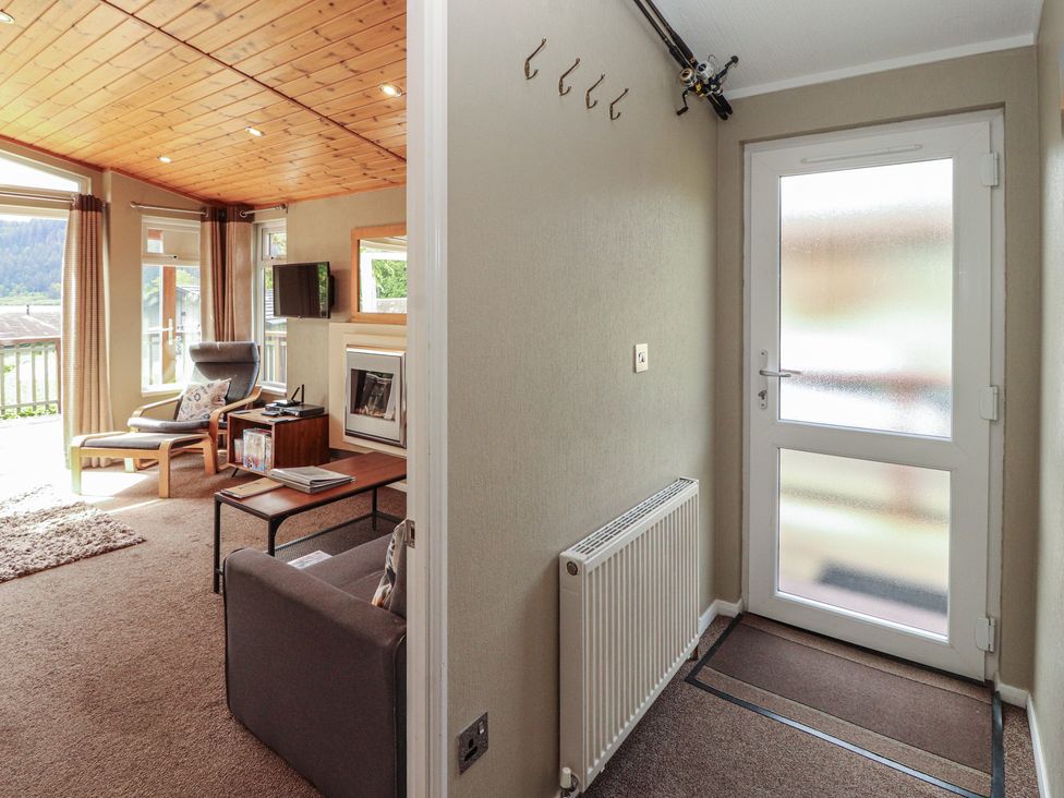 A living room with a sofa and armchair at 28 Troutbeck in Bassenthwaite