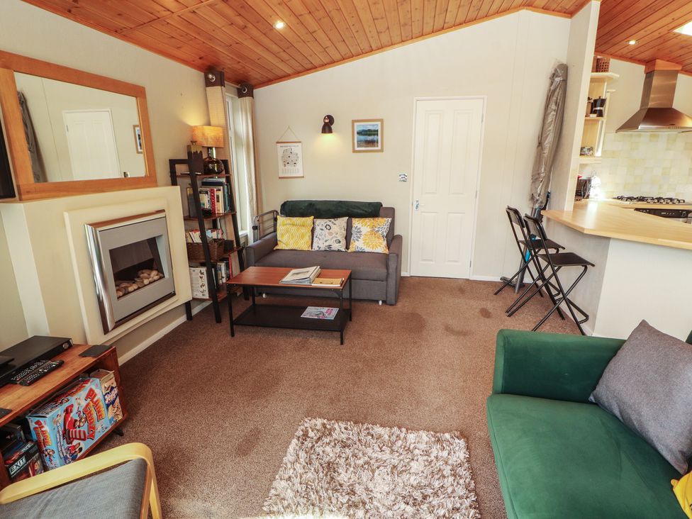 A living room with sofas and a coffee table at 28 Troutbeck in Bassenthwaite