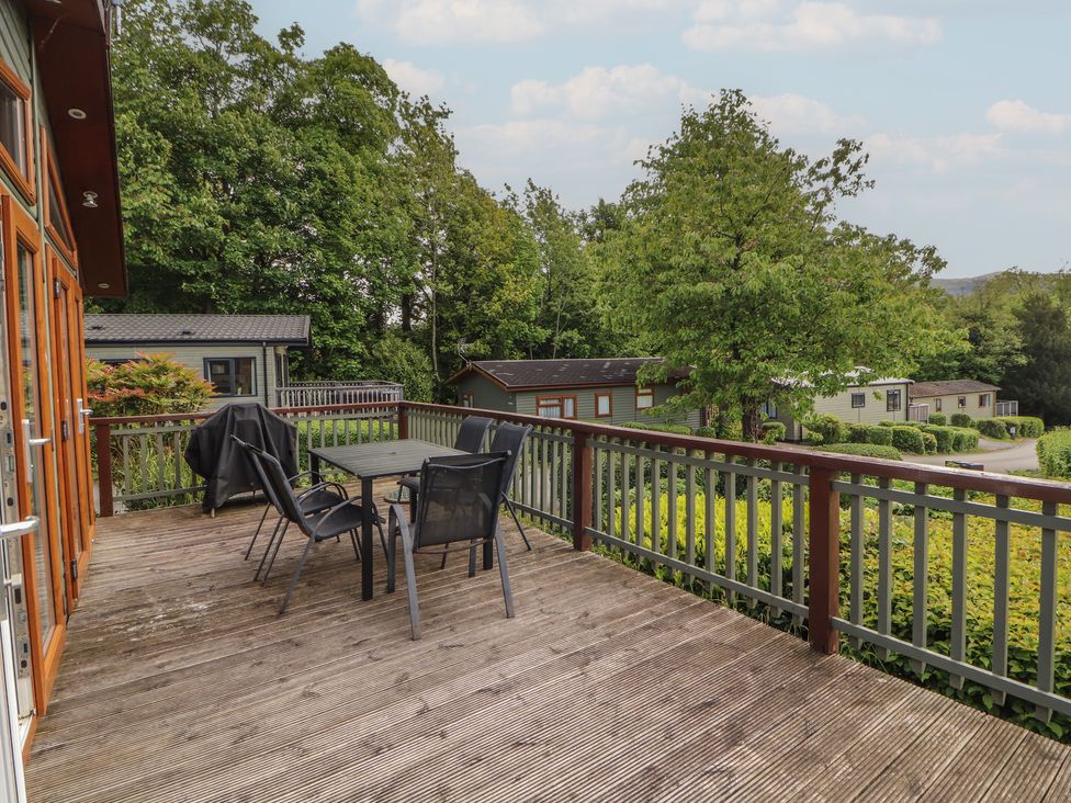 An outdoor area with a deck and furniture at 28 Troutbeck in Bassenthwaite