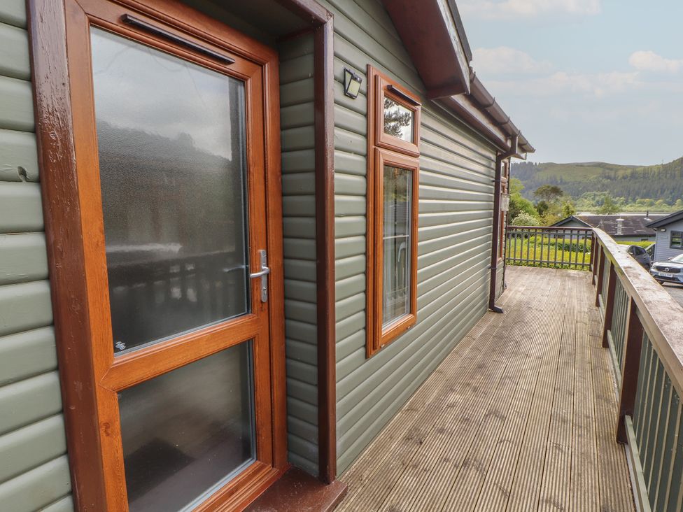 A door and windows on a wooden deck at 28 Troutbeck in Bassenthwaite