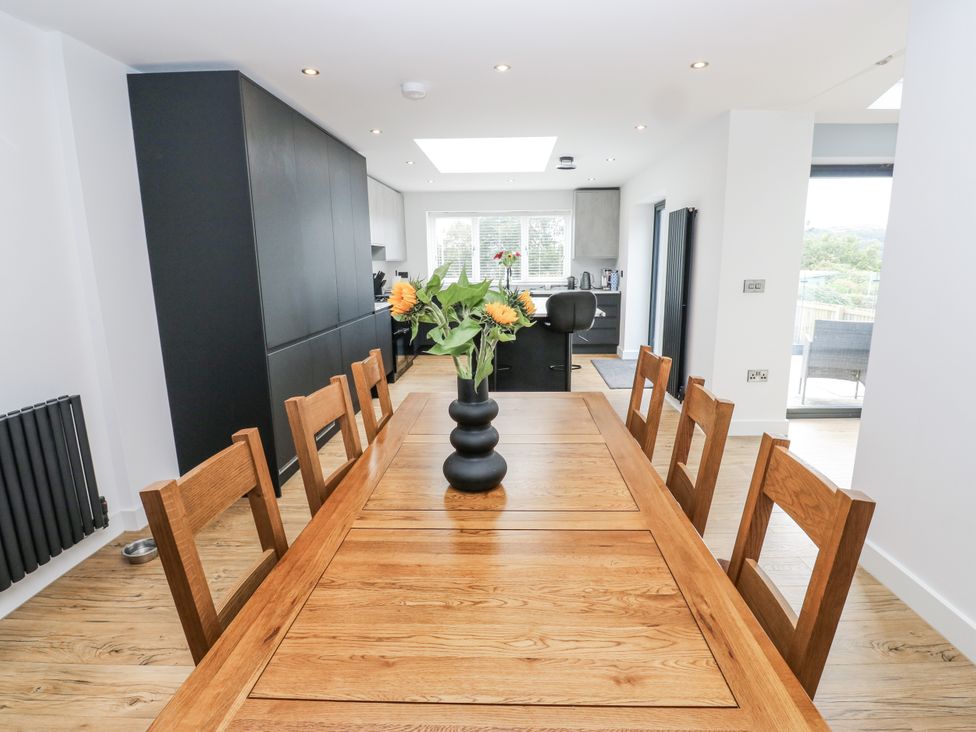 A dining room with a table and chairs at Ellis House in Huddersfield