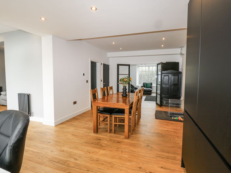 A dining room with a table and chairs at Ellis House in Huddersfield