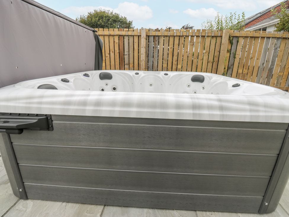 A hot tub in an outdoor area at Ellis House in Huddersfield