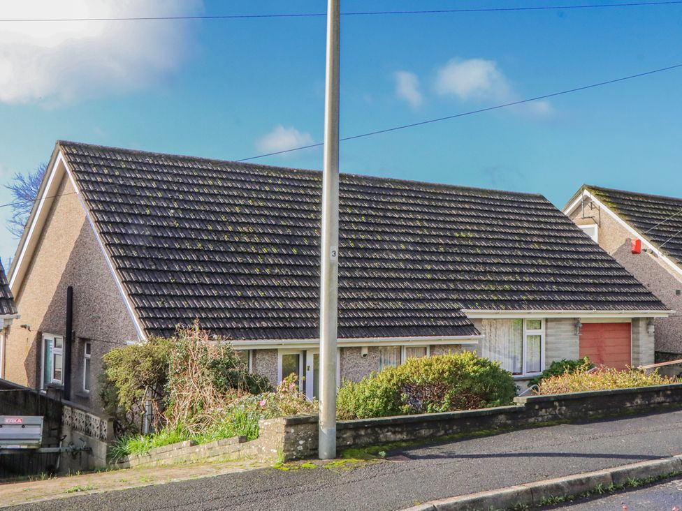 A house with a sloped roof and garage at 7 Erme Drive in Ivybridge