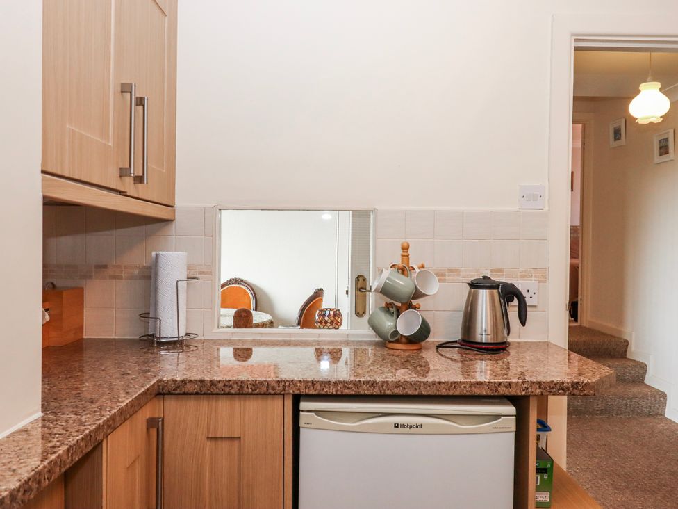 A kitchen with a kettle and cups at 7 Erme Drive in Ivybridge