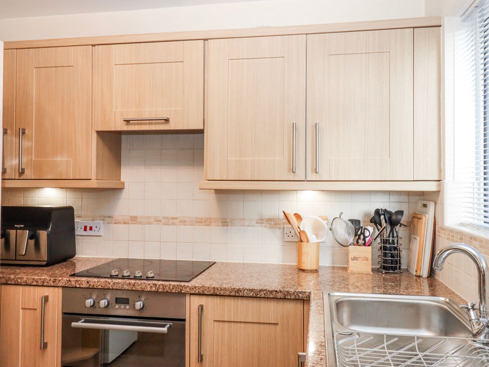 A kitchen with cabinets and a countertop at 7 Erme Drive in Ivybridge