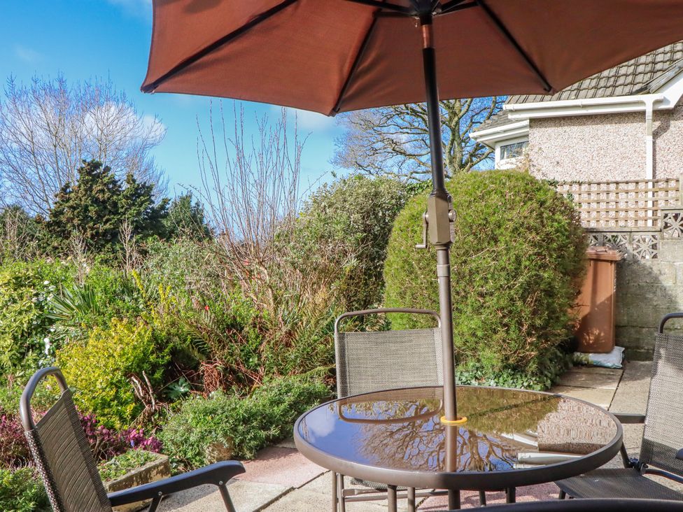 A garden with outdoor furniture at 7 Erme Drive in Ivybridge