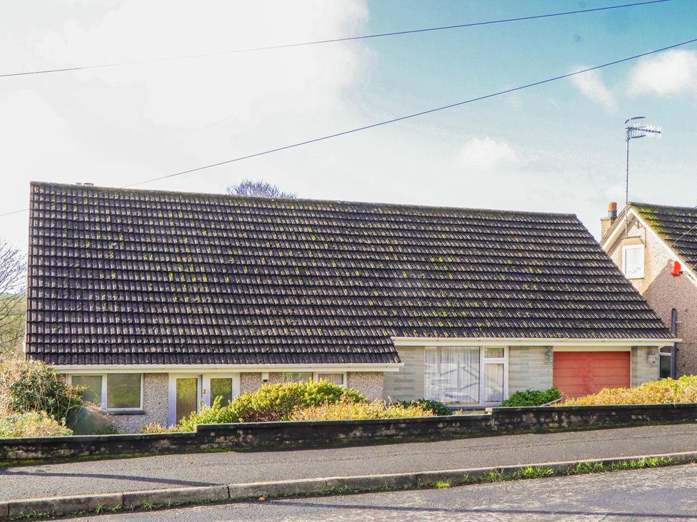 A house with a garage and windows at 7 Erme Drive in Ivybridge