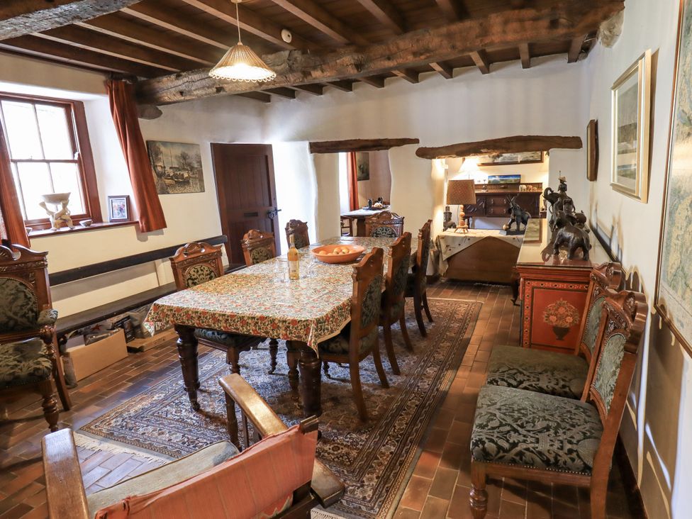 A dining room with a table and chairs at Chapel Cottage in Ennerdale near Cleator Moor