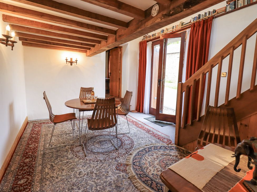 A dining room with a table and chairs at Chapel Cottage in Ennerdale near Cleator Moor