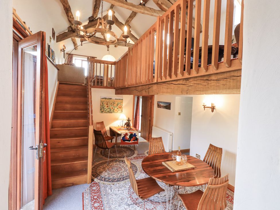 A dining area with a table and chairs at Chapel Cottage Ennerdale near Cleator Moor