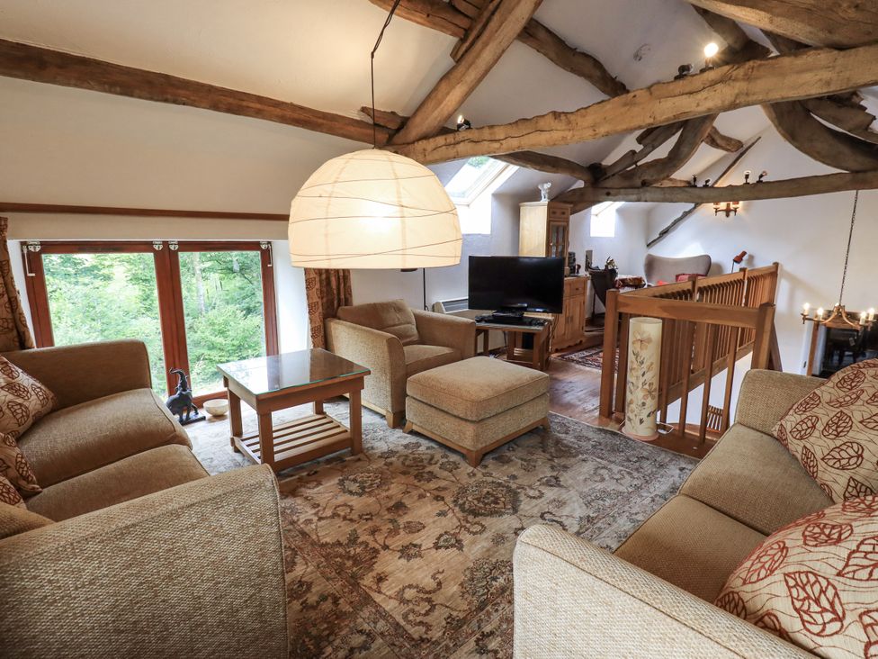 A living room with sofas and a television at Chapel Cottage Ennerdale near Cleator Moor