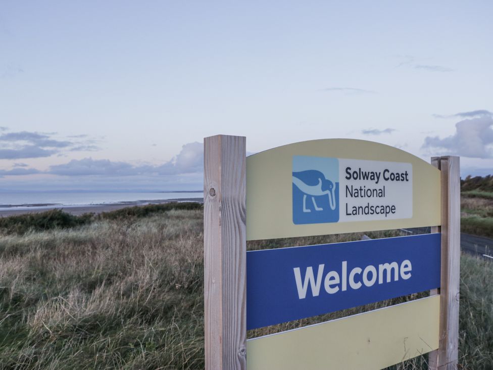 A welcome sign for Solway Coast National Landscape