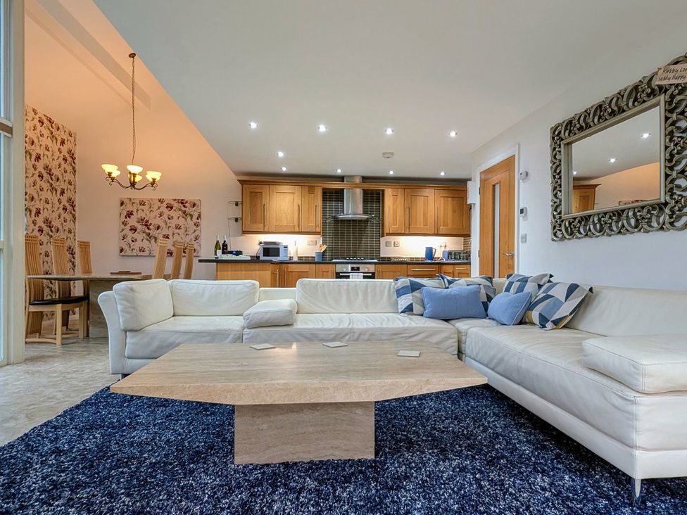 A living room with a sofa and coffee table at High View Meadows in Kirkby Lonsdale