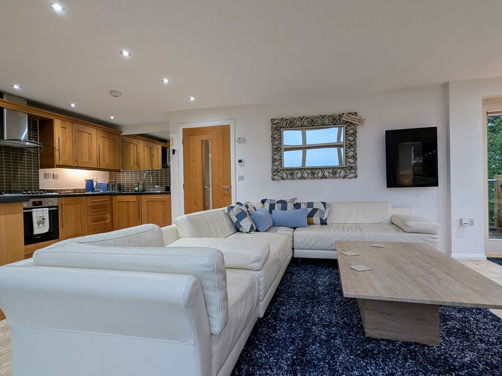 A living room featuring a sofa and coffee table at High View Meadows in Kirkby Lonsdale