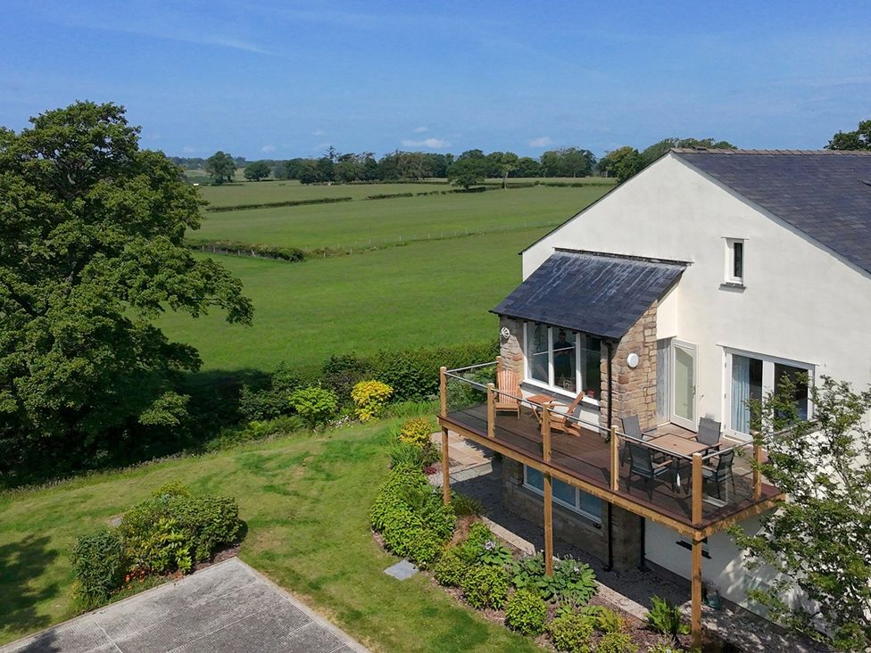 A house with a deck and chairs in Kirkby Lonsdale