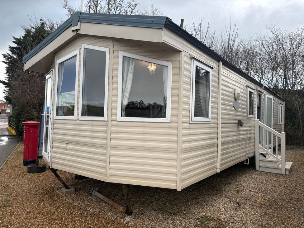 A caravan with windows and a door at Caravan 941 in Clacton-On-Sea