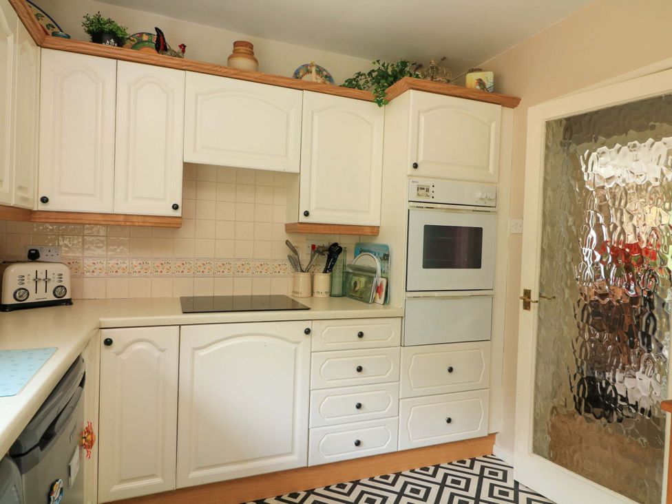 A kitchen with cabinets, countertop, oven, and toaster at 3 Chantry Hill in Kingsbridge